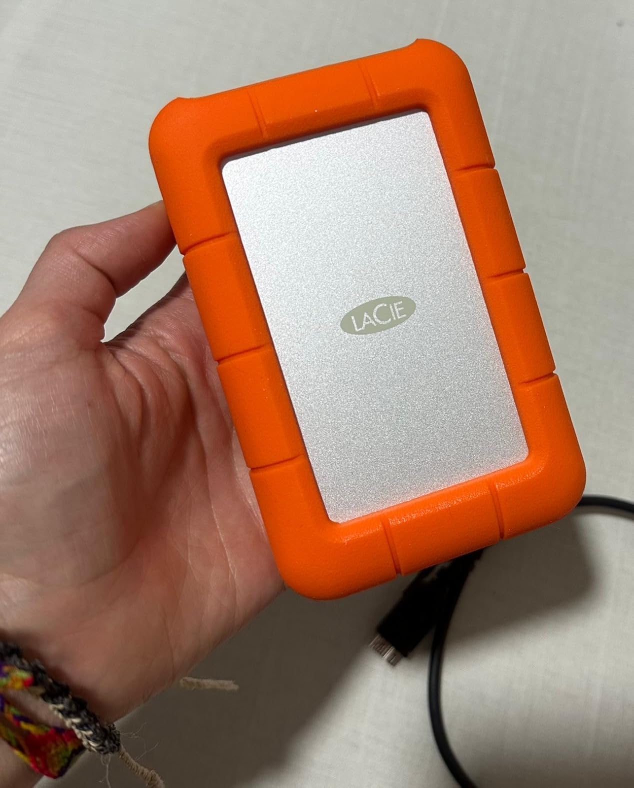 LaCie Rugged Mini 2TB External Hard Drive Portable HDD - USB 3.0/ 2.0 Compatible, Drop Shock Dust Rain Resistant Shuttle Drive, For Mac And PC Computer (LAC9000298), orange - Customer Photo 4