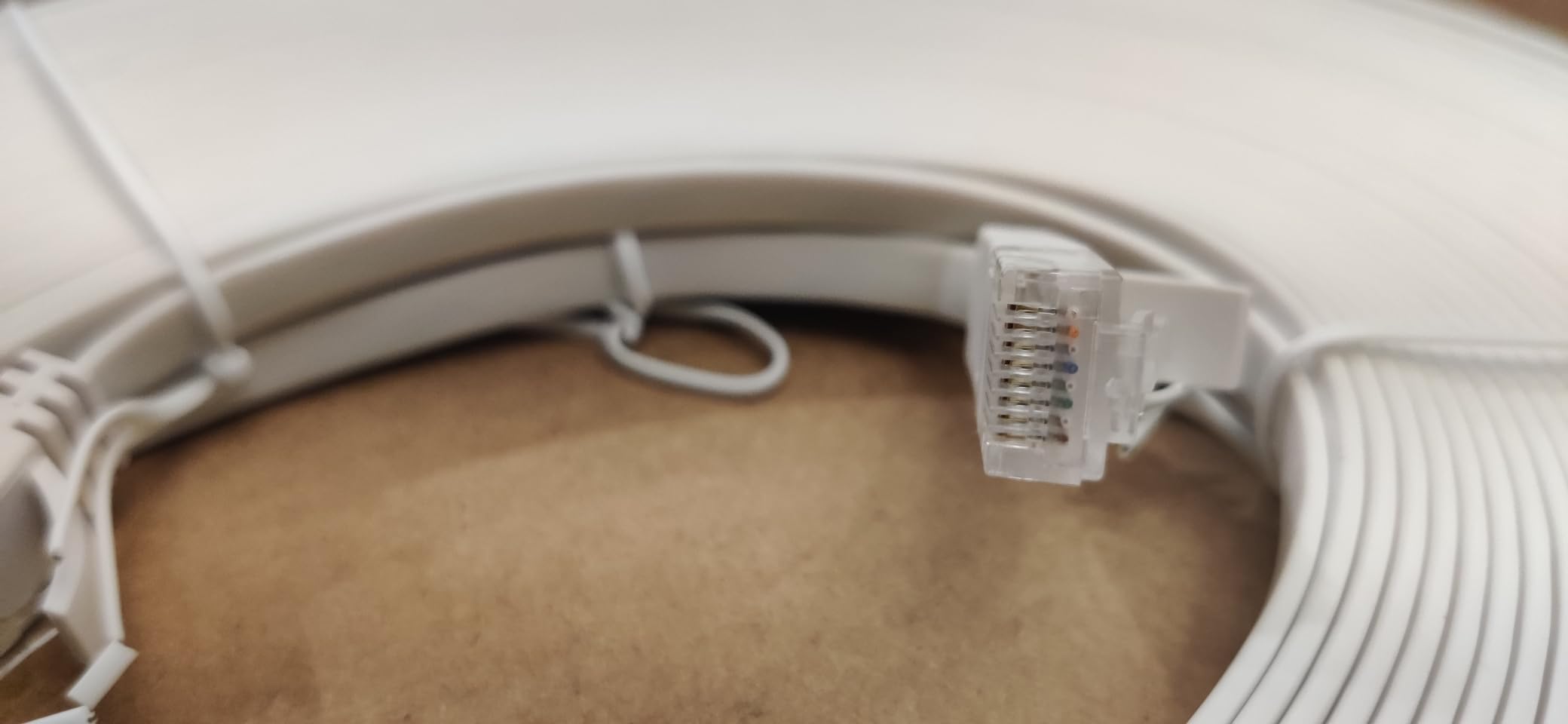 Amazon Basics Cat 6 Ethernet RJ45 10Gbps Flat Network Cable, 100ft Snagless with Gold-Plated Connectors, Outdoor & Indoor Solid Patch Cord with Clips for Router, Modem, Gaming, Computer, White customer photo 2