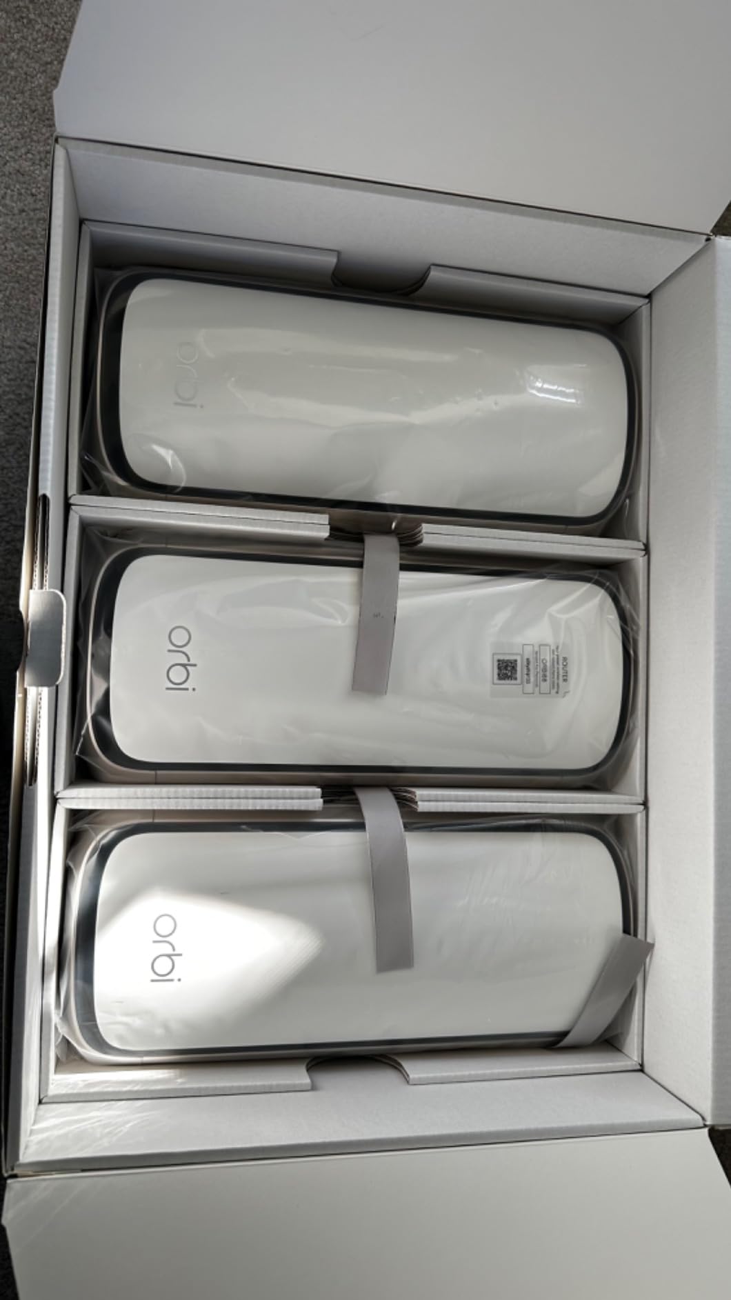 NETGEAR Orbi 970 Series Quad-Band WiFi 7 Mesh Network System (RBE973S), Router + 2 Satellite Extenders, Security Features, Up to 27Gbps, Covers Up to 10,000 sq. ft., 200 Devices, 10 Gig Internet Port customer photo 1