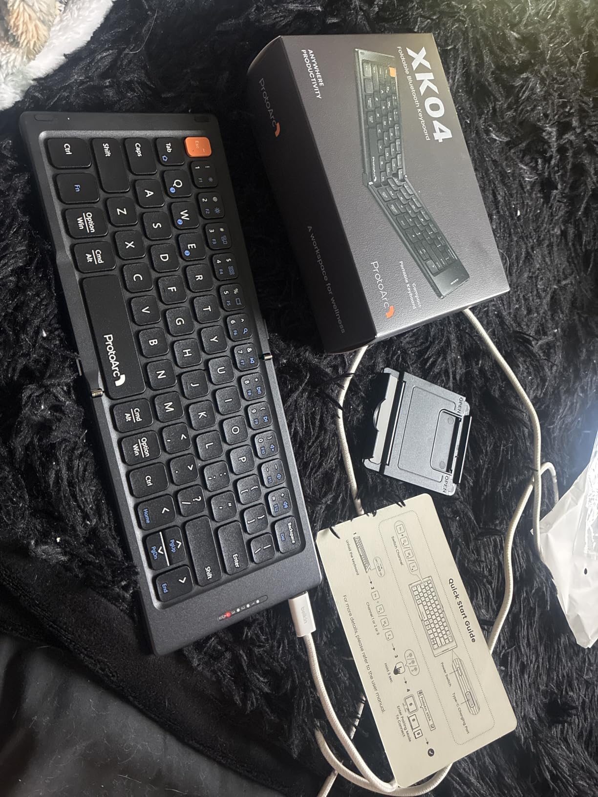 ProtoArc XK04 Foldable Compact Keyboard for Phone and Tablet, Black, Pocket-Sized, PU Leather Cover, Bluetooth 3-Device Workflow, for Business Travelers, On-the-go Typing customer photo 1