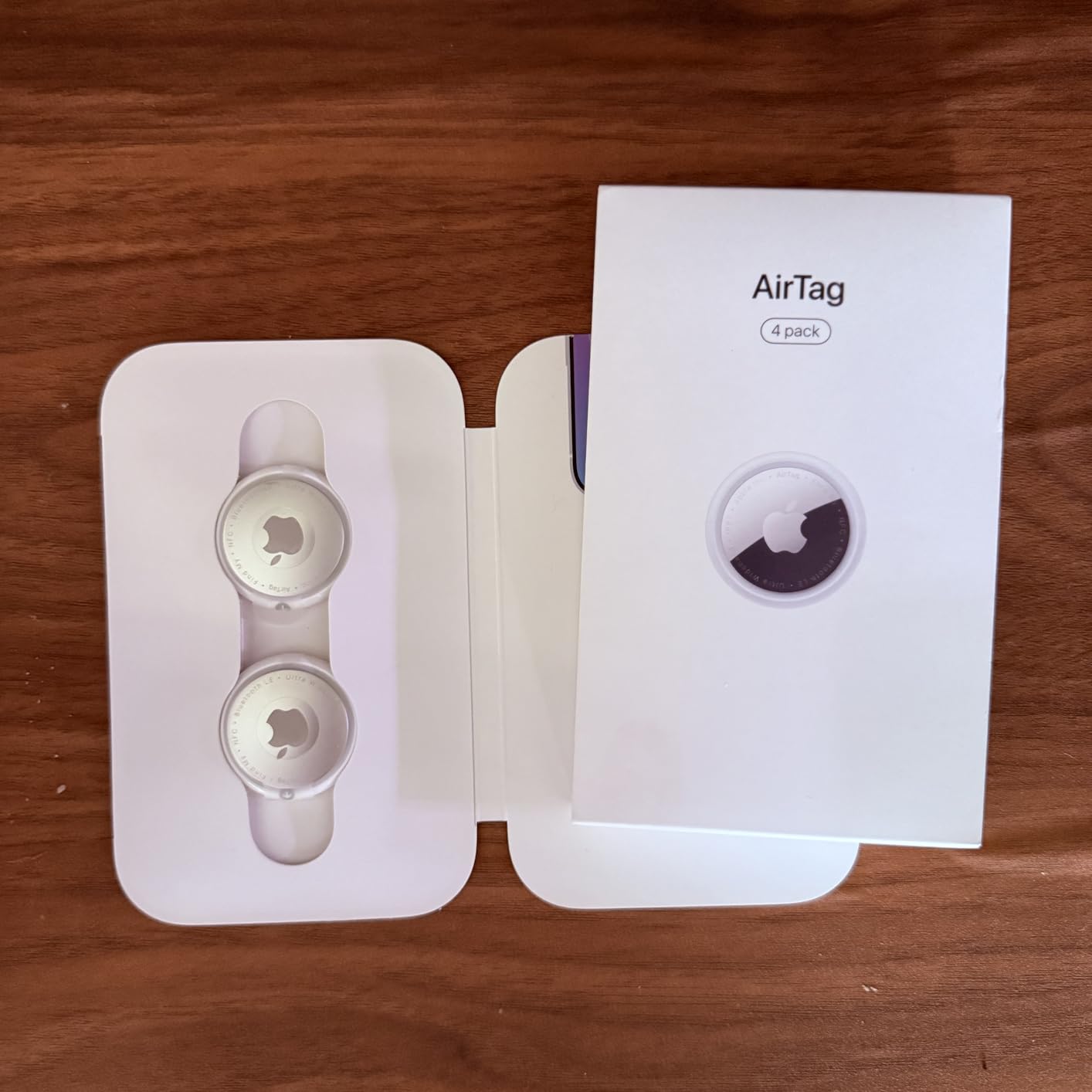 Apple AirTag (1st Generation) - 4 Pack. Keep Track of and find Your Keys, Wallet, Luggage, Backpack, and More. Simple one-tap Set up with iPhone or iPad, Bluetooth customer photo 1